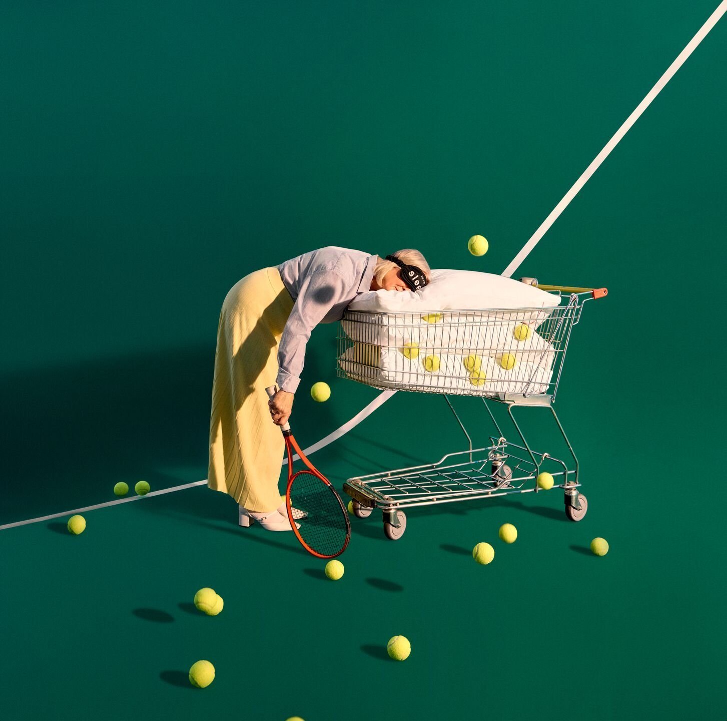 Summer Sale 2024: a tennis player asleep in a shopping trolley of pillows